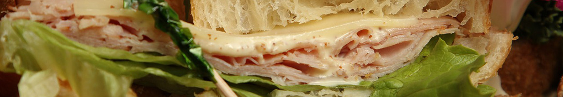 Eating Sandwich Cafe at Manoa Bakery Cafe restaurant in Annandale, VA.